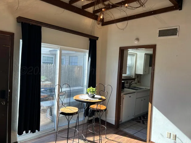 a room with a table and chairs