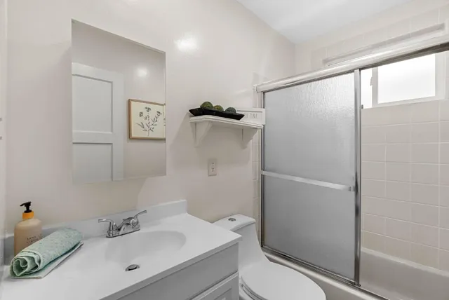 a view of a house with a door and a yard