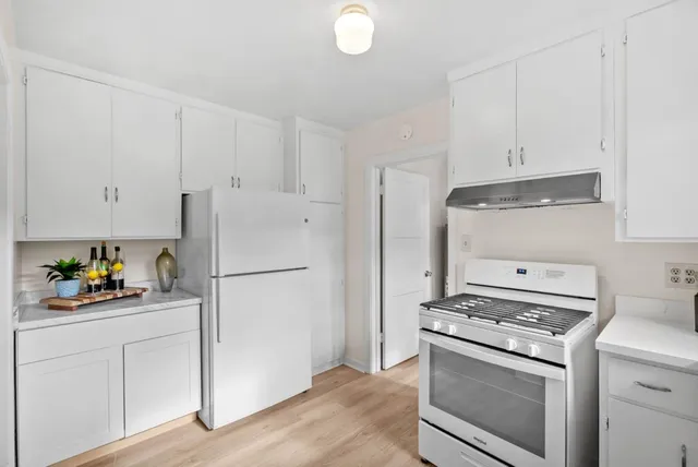 a living room with a sink and a window