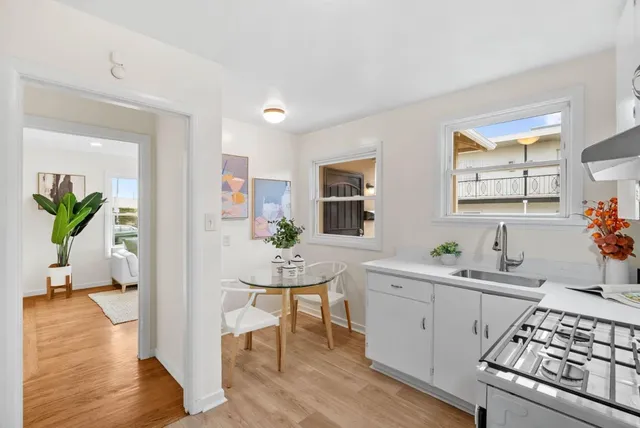a kitchen with a stove and a refrigerator