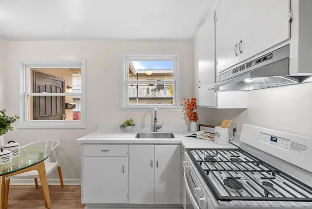 a view of bathroom with dual sinks