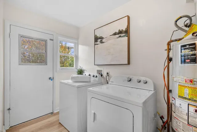 a bedroom with bed and window