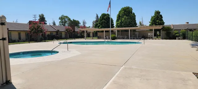 a view of house with outdoor space and sitting area