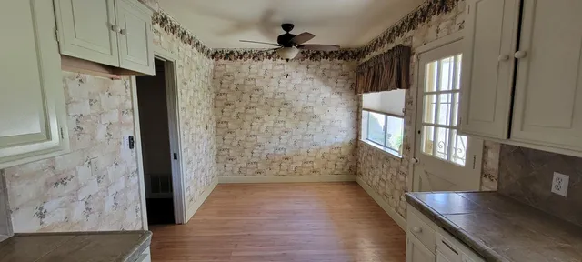 a view of gallery with wooden floor