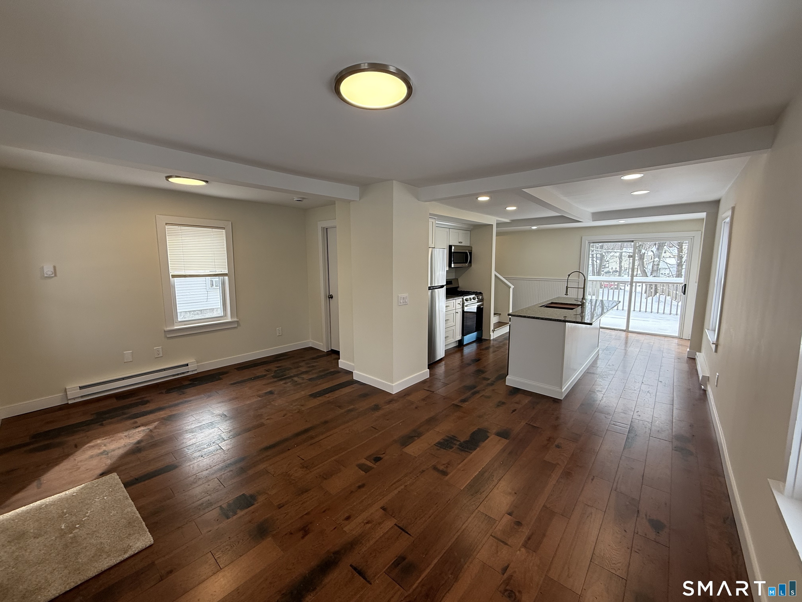 98 East Elm Street Torrington, CT 06790 - Photo 2 of 10 a view of empty room with wooden floor and window