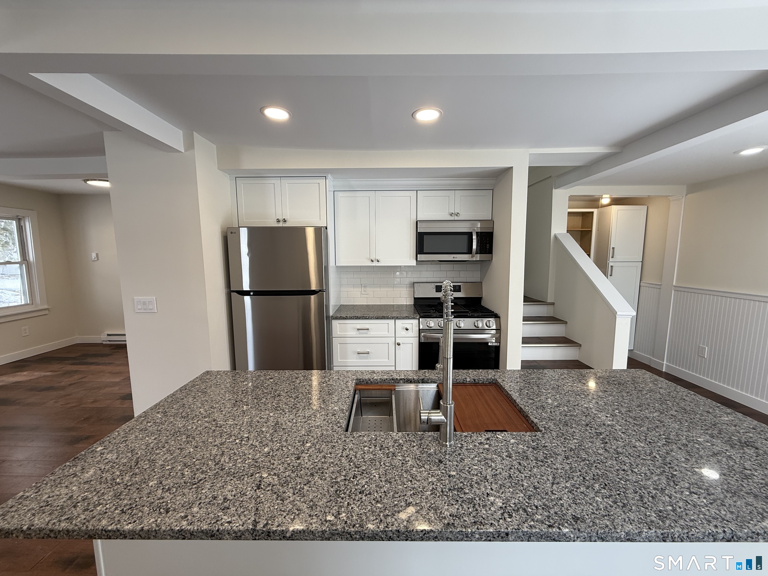 98 East Elm Street Torrington, CT 06790 - Photo 3 of 10 a kitchen with a refrigerator sink and cabinets
