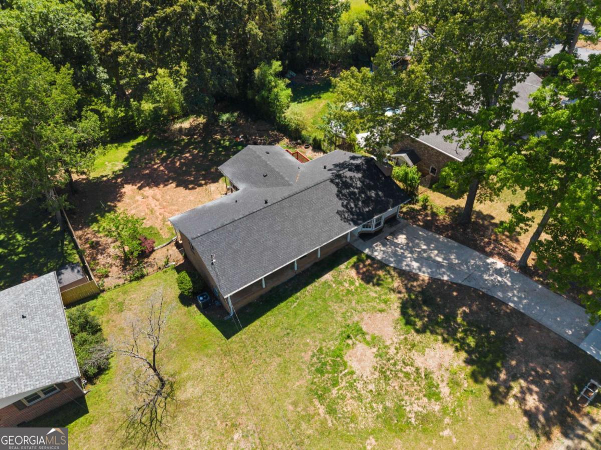 865 Old Tucker Road Stone Mountain, GA 30087 - Photo 50 of 57 an aerial view of a house with a yard basket ball court and outdoor seating