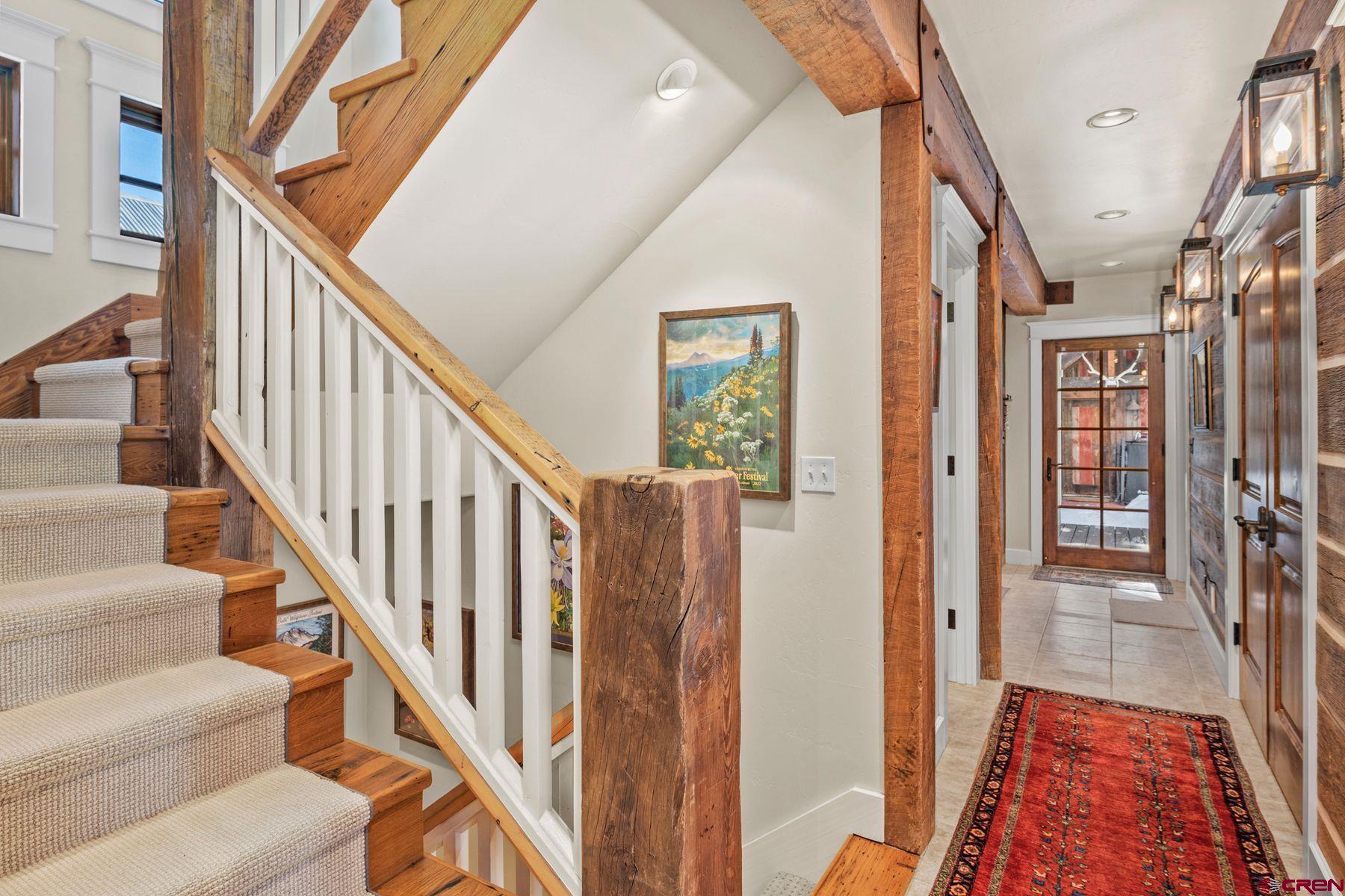 18 Maroon Avenue Crested Butte, CO 81224 - Photo 20 of 45 a view of an entryway with wooden floor and stairs
