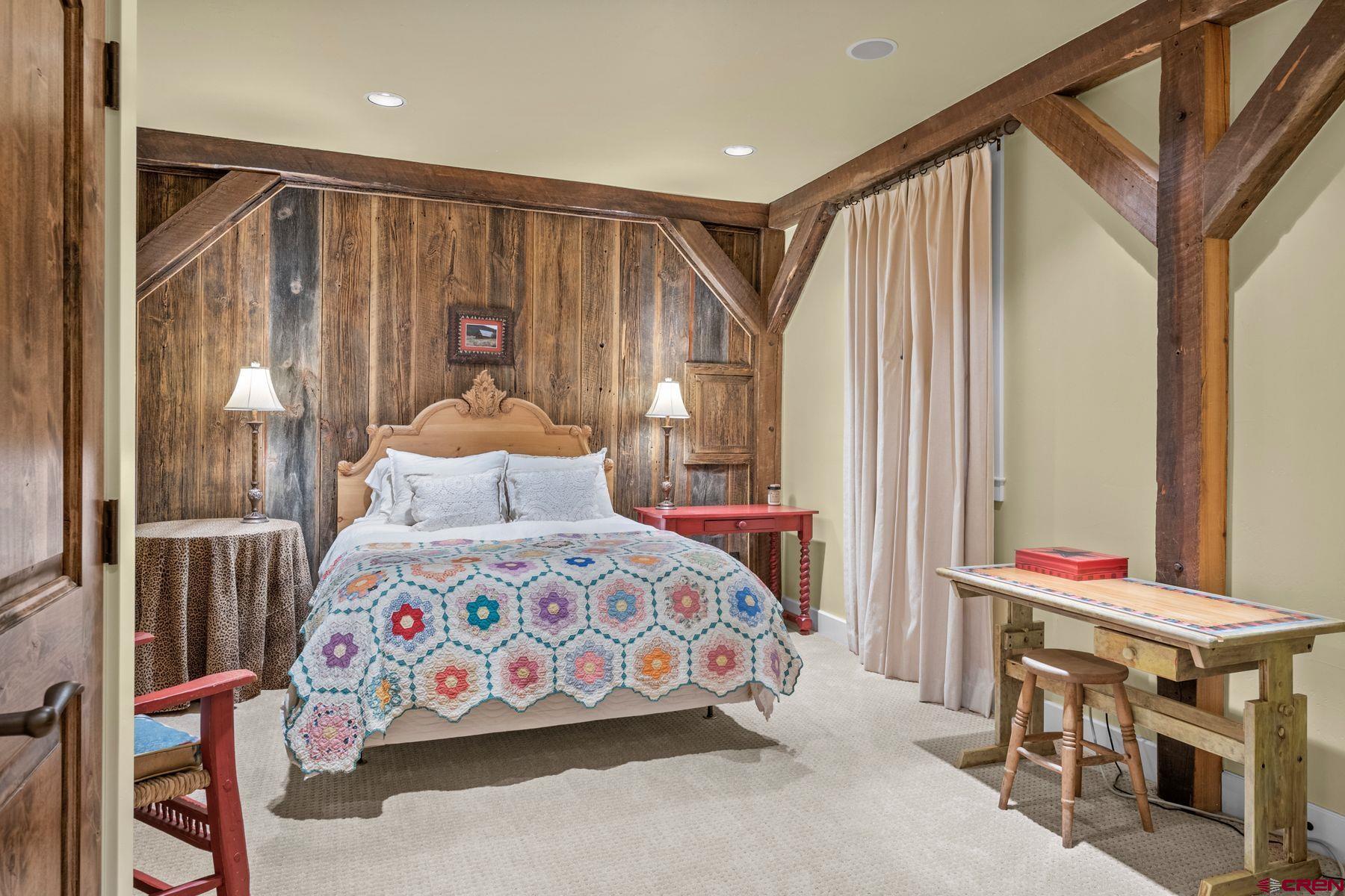 18 Maroon Avenue Crested Butte, CO 81224 - Photo 35 of 45 a bedroom with a bed and a table
