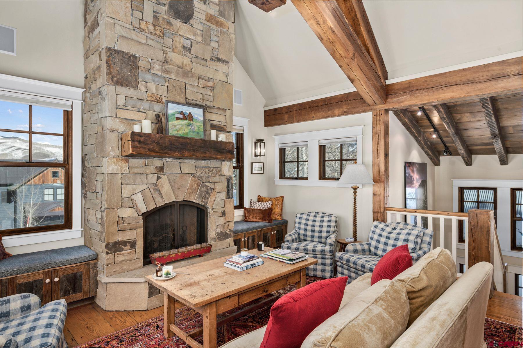 18 Maroon Avenue Crested Butte, CO 81224 - Photo 8 of 45 a living room with furniture and a fireplace