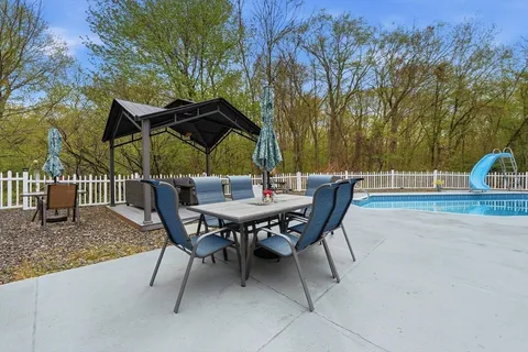a patio with table and chairs
