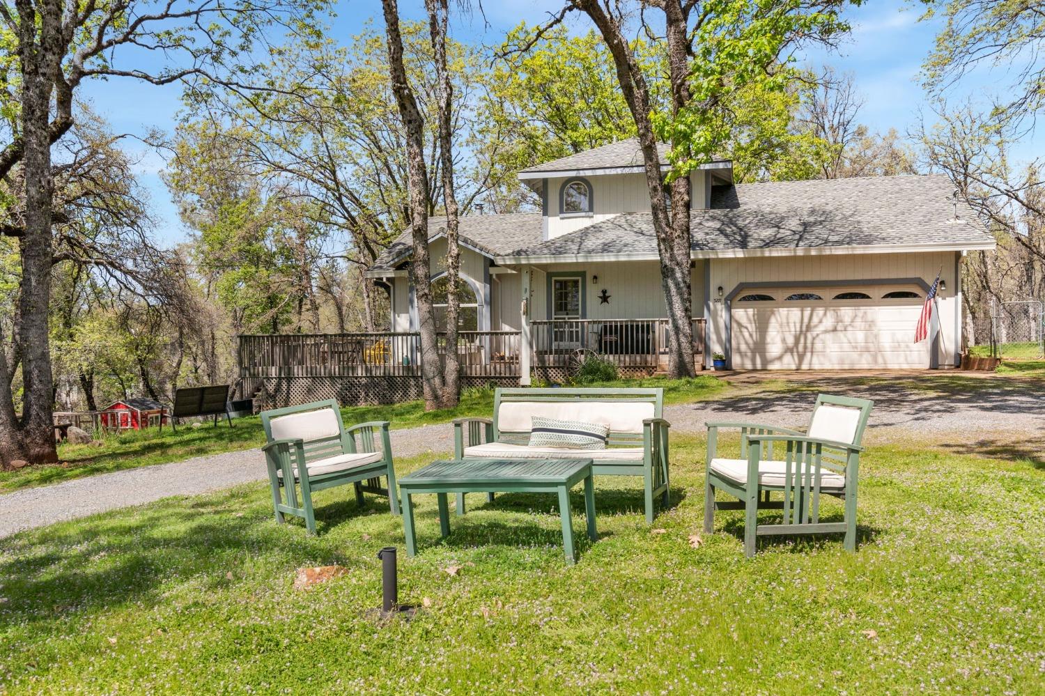 5271 Caprine Road Greenwood, CA 95635 - Photo 16 of 39 a view of a house with backyard porch and sitting area