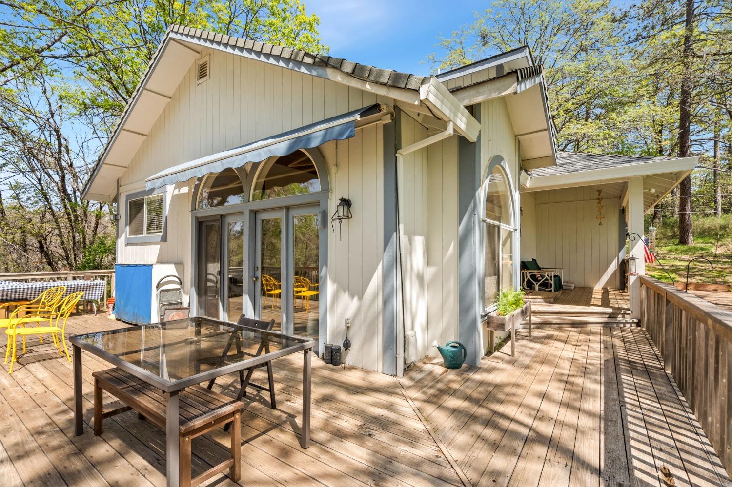5271 Caprine Road Greenwood, CA 95635 - Photo 18 of 39 a view of house with patio outdoor seating and covered with trees