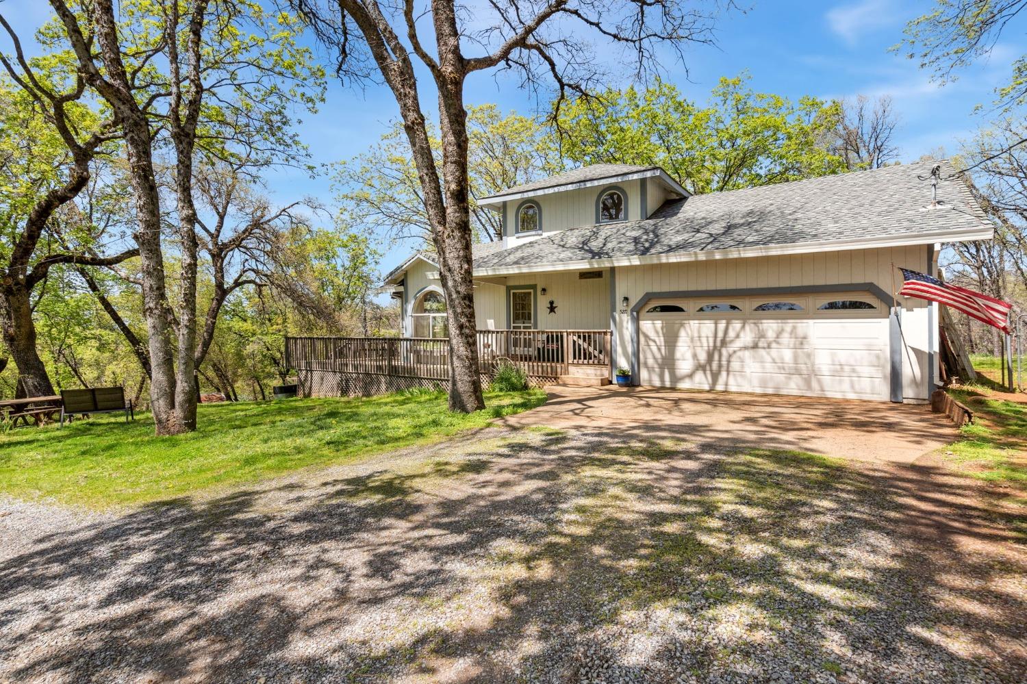 5271 Caprine Road Greenwood, CA 95635 - Photo 2 of 39 a front view of a house with garden