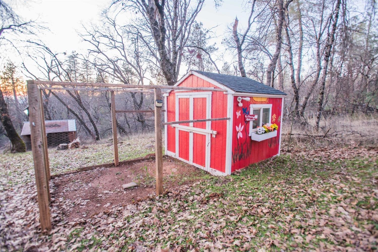 5271 Caprine Road Greenwood, CA 95635 - Photo 23 of 39 a sign that is sitting in front of a house