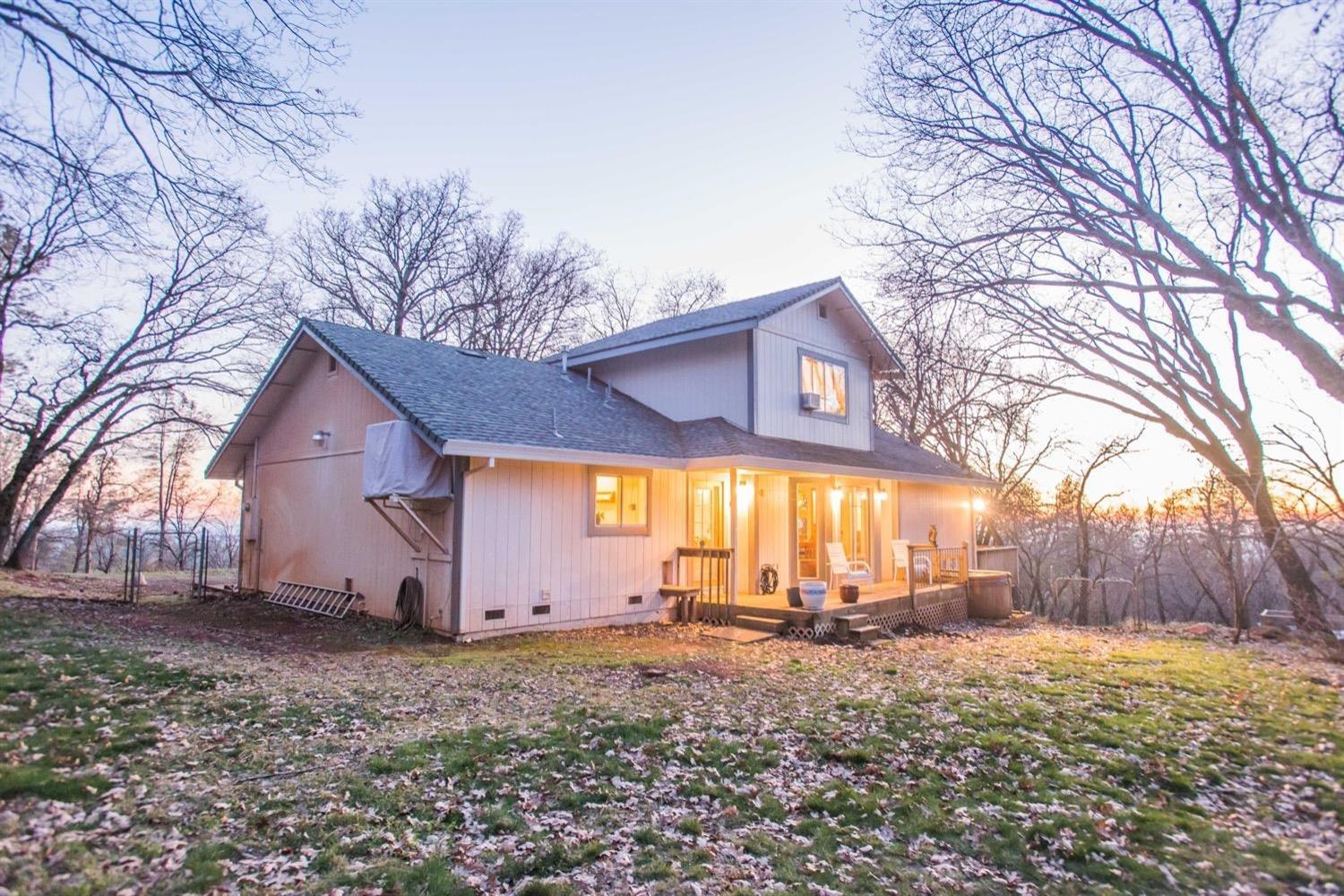 5271 Caprine Road Greenwood, CA 95635 - Photo 33 of 39 a view of wooden house with a yard and large trees