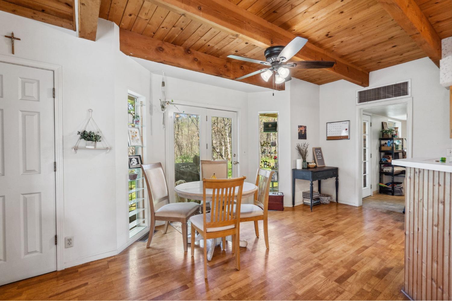 5271 Caprine Road Greenwood, CA 95635 - Photo 7 of 39 a view of a livingroom with furniture and a dining table with chairs