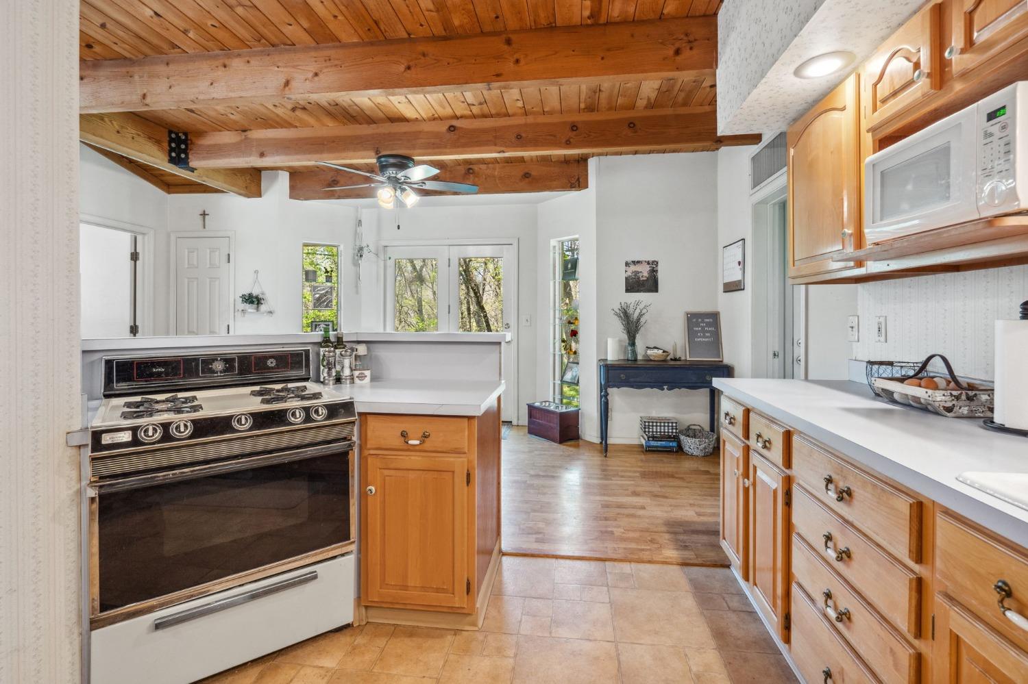 5271 Caprine Road Greenwood, CA 95635 - Photo 10 of 39 a kitchen with stainless steel appliances granite countertop a stove and a sink