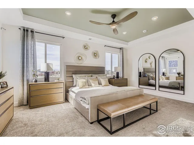 a bed room with a bed and a large window