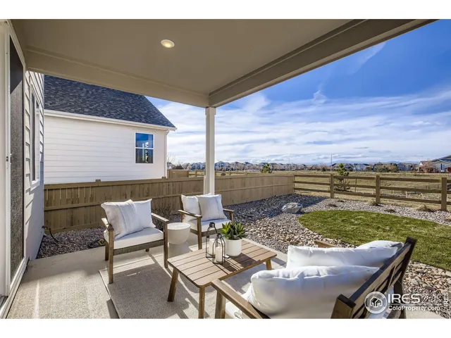a outdoor living space with patio furniture and potted plants