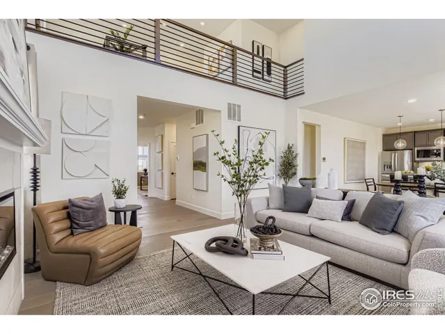 a living room with furniture a chandelier