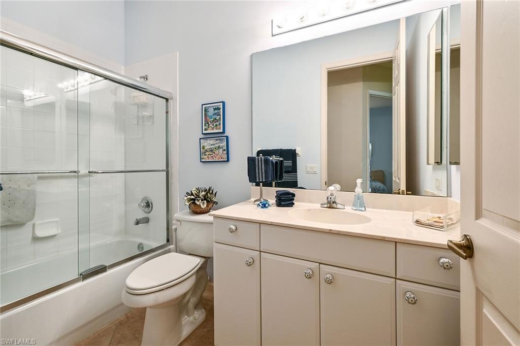 3359 Sandpiper Way Naples, FL 34109 - Photo 22 of 41 a bathroom with a sink toilet and shower