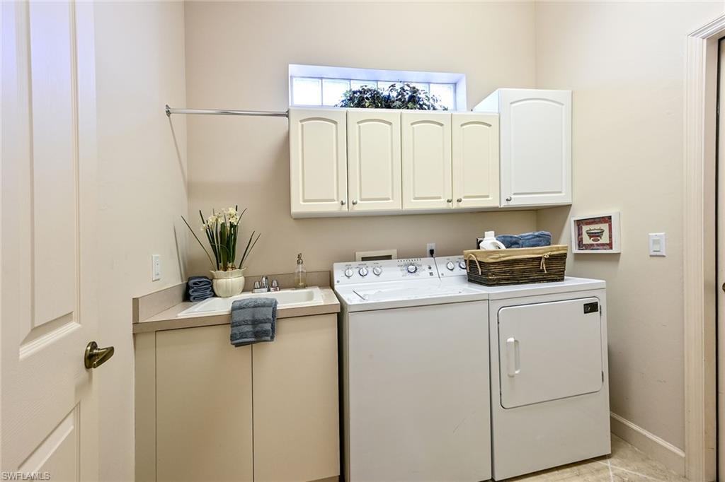 3359 Sandpiper Way Naples, FL 34109 - Photo 23 of 41 a room with storage and utility