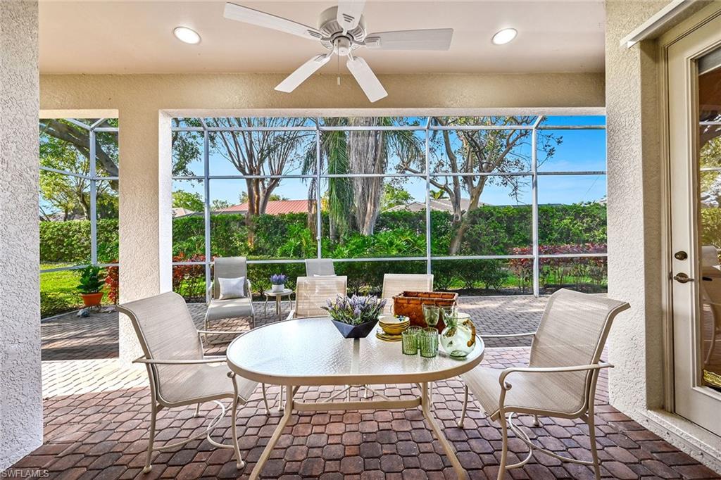 3359 Sandpiper Way Naples, FL 34109 - Photo 24 of 41 a view of a patio with a dining table and chairs