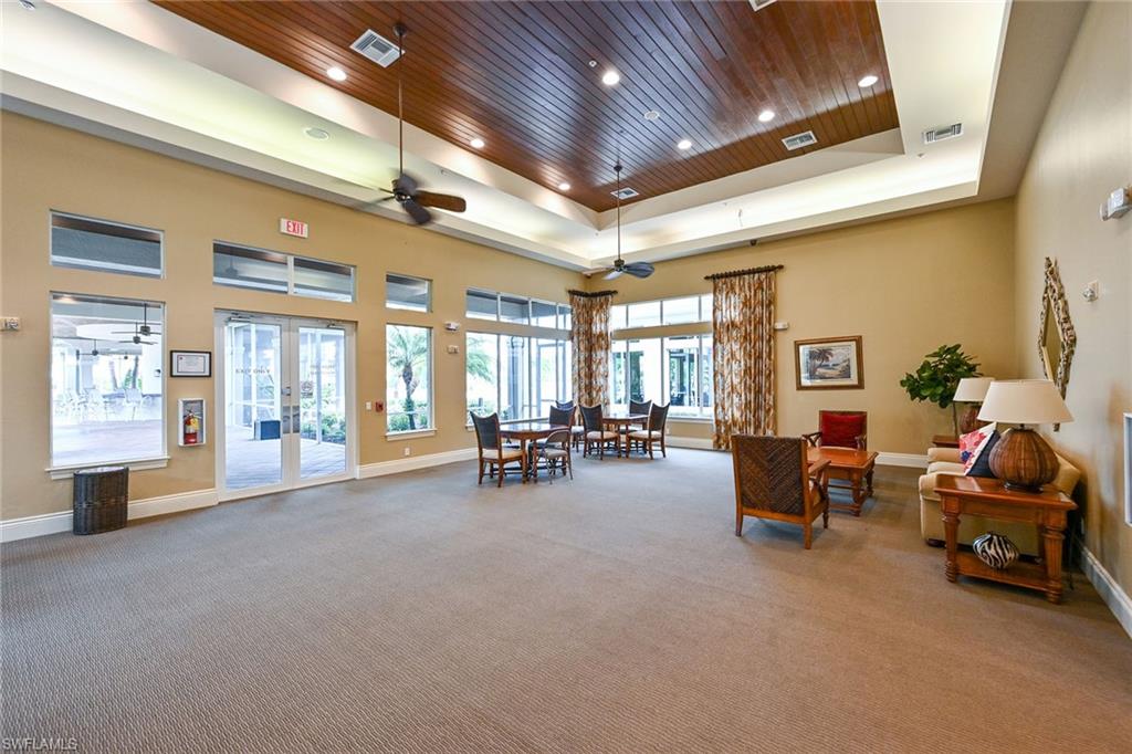 3359 Sandpiper Way Naples, FL 34109 - Photo 30 of 41 a lobby with furniture and floor to ceiling window