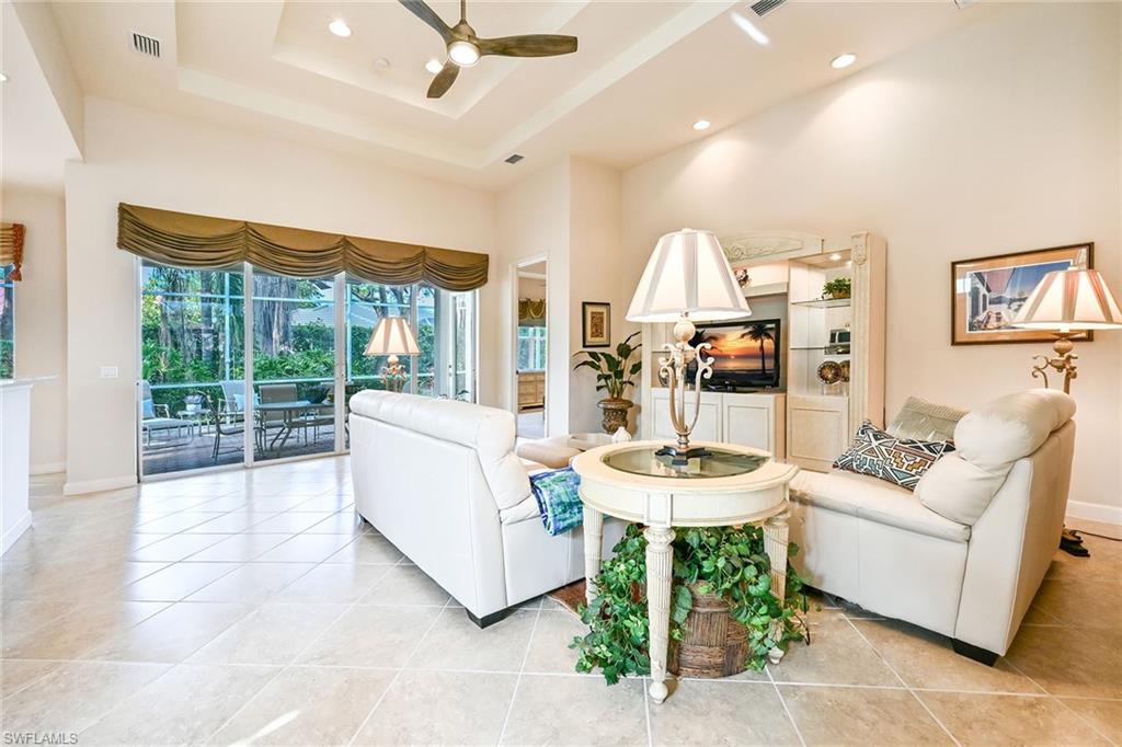 3359 Sandpiper Way Naples, FL 34109 - Photo 4 of 41 a living room with furniture and a large window