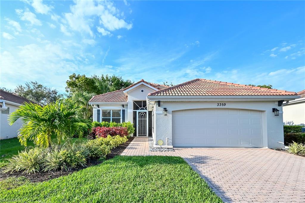 3359 Sandpiper Way Naples, FL 34109 - Photo 41 of 41 a front view of a house with garden