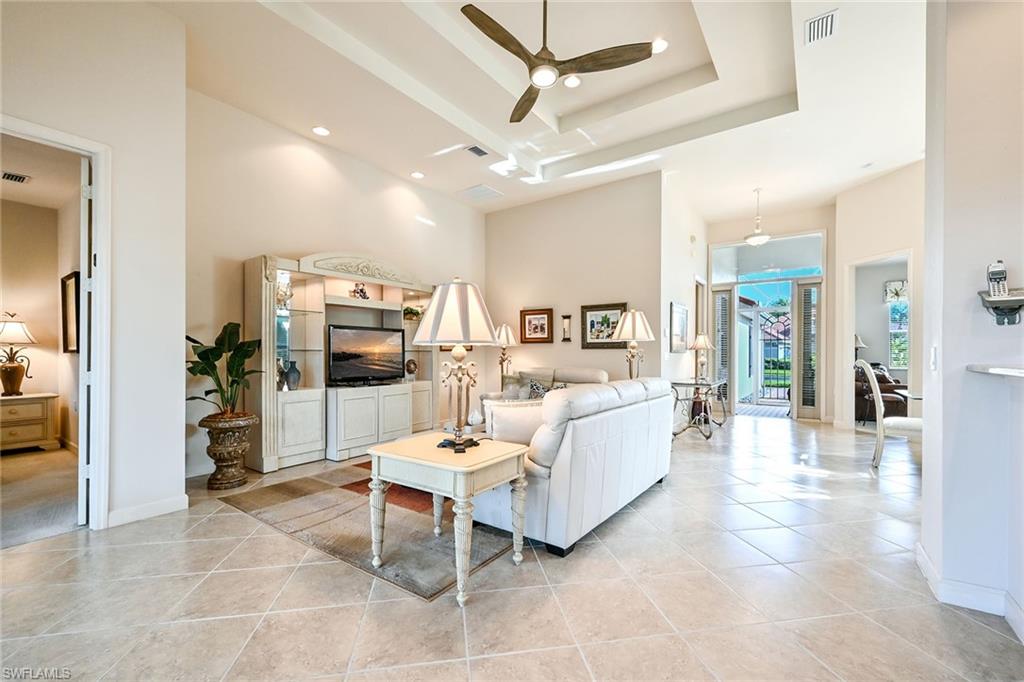 3359 Sandpiper Way Naples, FL 34109 - Photo 7 of 41 a living room with furniture and wooden floor