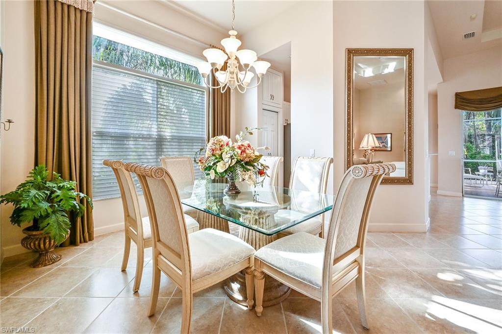 3359 Sandpiper Way Naples, FL 34109 - Photo 9 of 41 a dining room with furniture and window