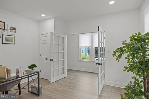 a view of an entryway with wooden floor