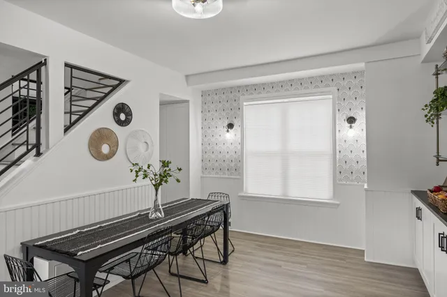 a room with chairs and a window