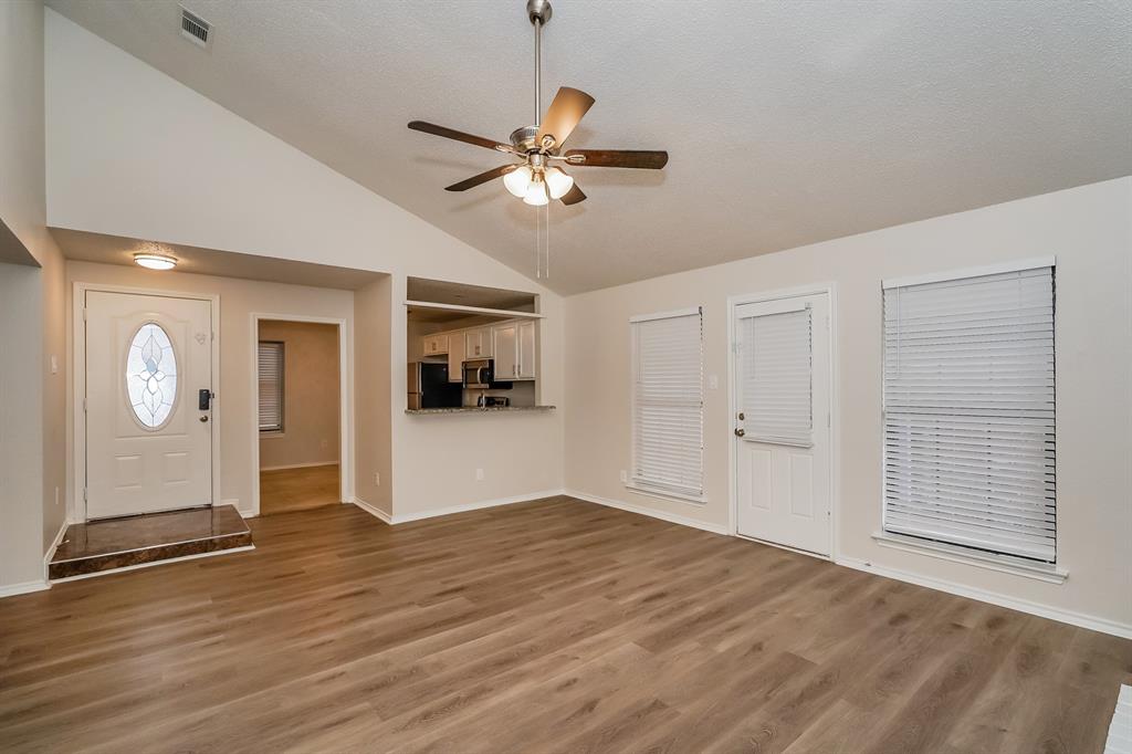 1334 Cedar Ridge Drive Lewisville, TX 75067 - Photo 5 of 16 a view of empty room with wooden floor
