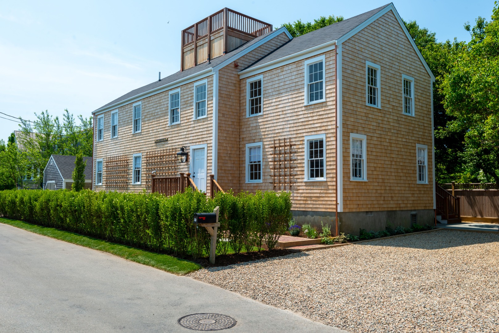12 Willard Street Nantucket, MA 02554 - Photo 2 of 36 a front view of a house with garden