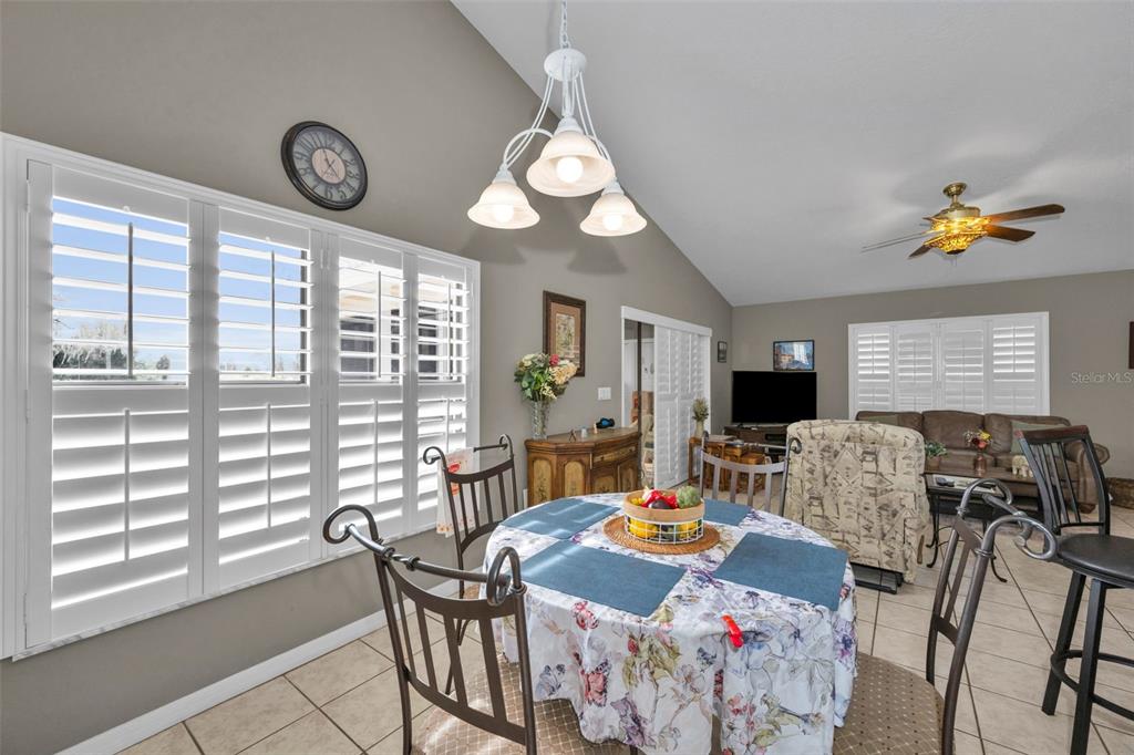 9630 Green Needle Drive New Port Richey, FL 34655 - Photo 9 of 23 a view of a dining room with furniture window and outside view