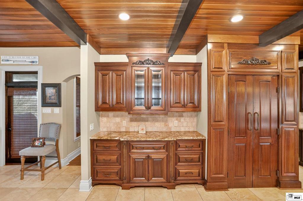 114 Apache Trail Delhi, LA 71232 - Photo 12 of 38 a kitchen with stainless steel appliances kitchen island granite countertop a refrigerator and a stove