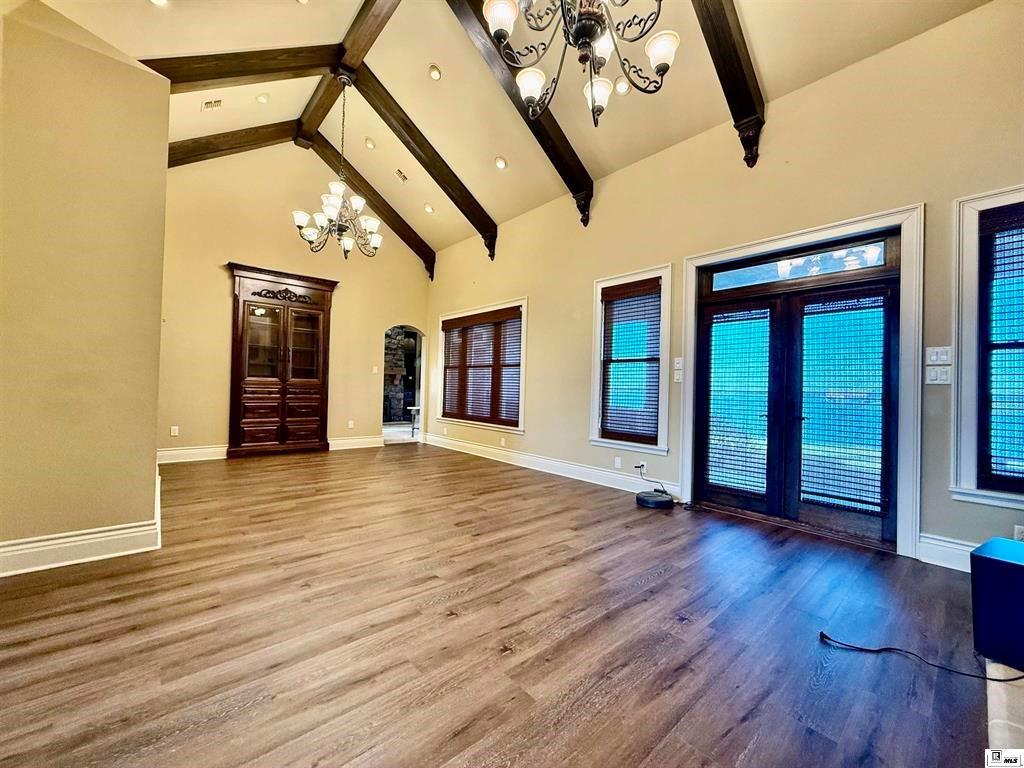114 Apache Trail Delhi, LA 71232 - Photo 19 of 38 a view of an empty room with wooden floor and a window