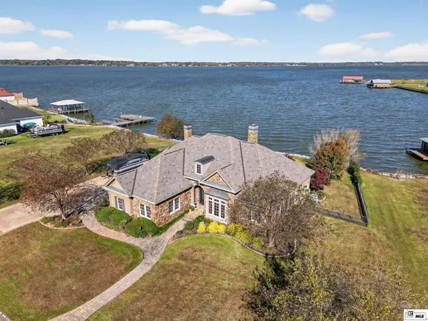 a aerial view of a house with a ocean view