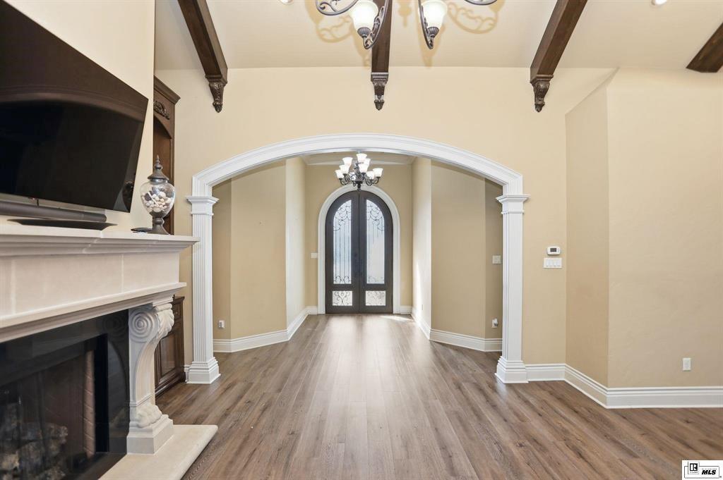 114 Apache Trail Delhi, LA 71232 - Photo 24 of 38 a view of a livingroom with wooden floor and a fireplace