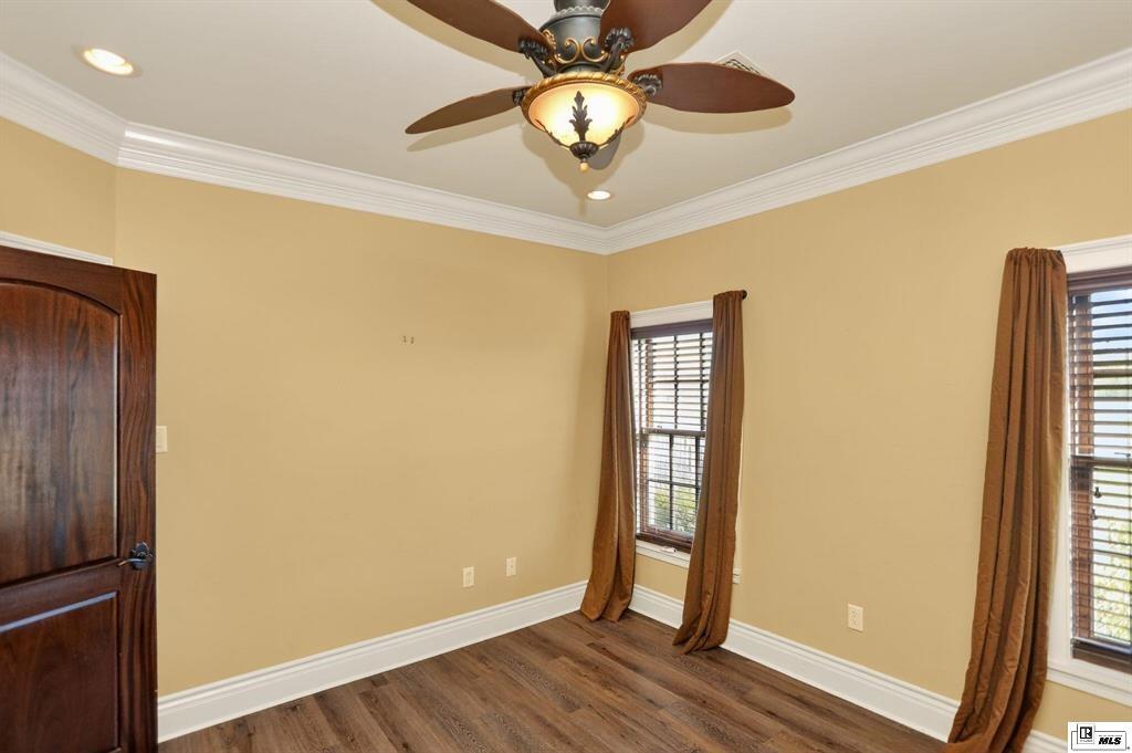 114 Apache Trail Delhi, LA 71232 - Photo 32 of 38 a view of an empty room with wooden floor and a window