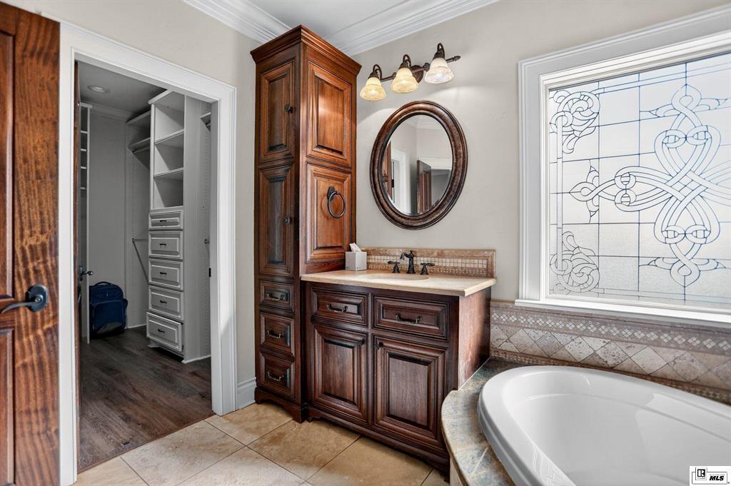 114 Apache Trail Delhi, LA 71232 - Photo 34 of 38 a bathroom with a granite countertop sink and a mirror