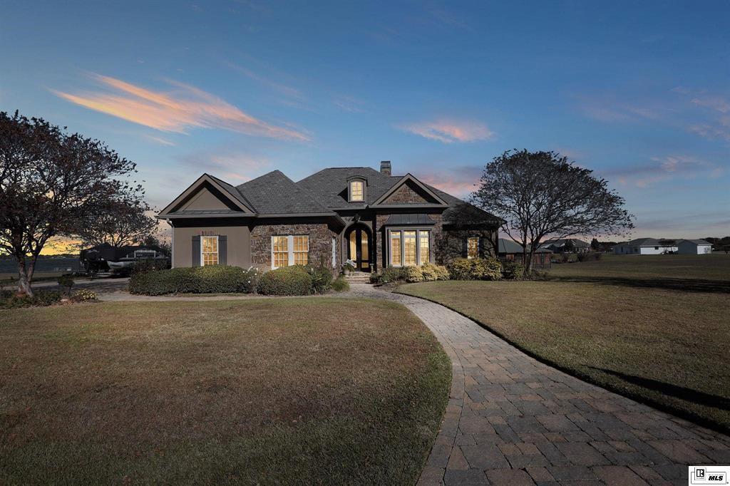 114 Apache Trail Delhi, LA 71232 - Photo 37 of 38 a front view of a house with a yard