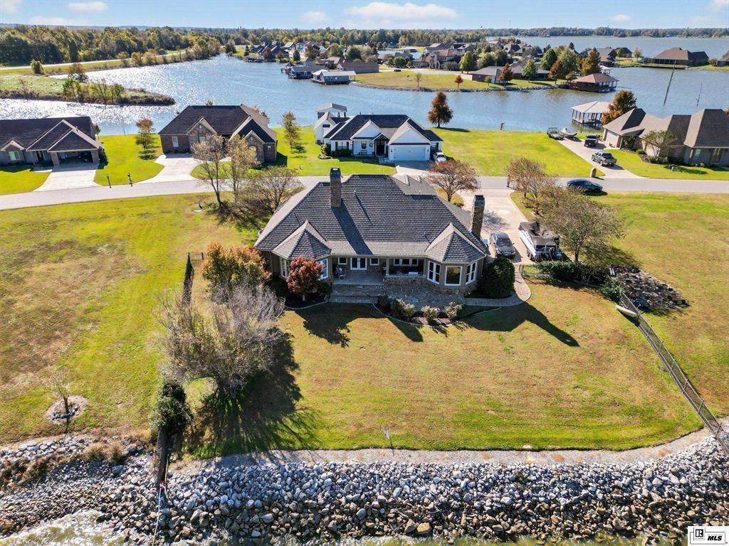 114 Apache Trail Delhi, LA 71232 - Photo 4 of 38 a view of a swimming pool with a table and chairs