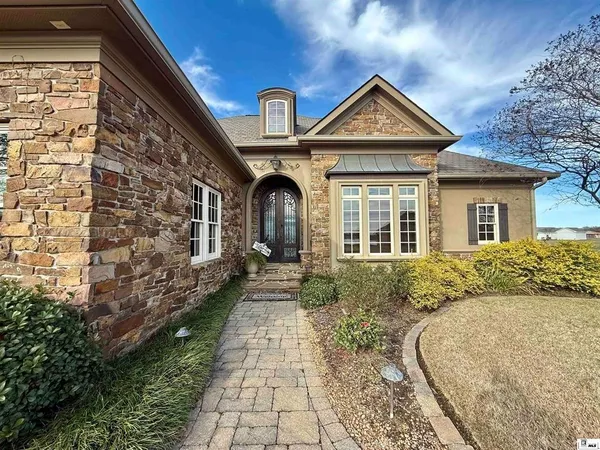 a front view of a house with garden