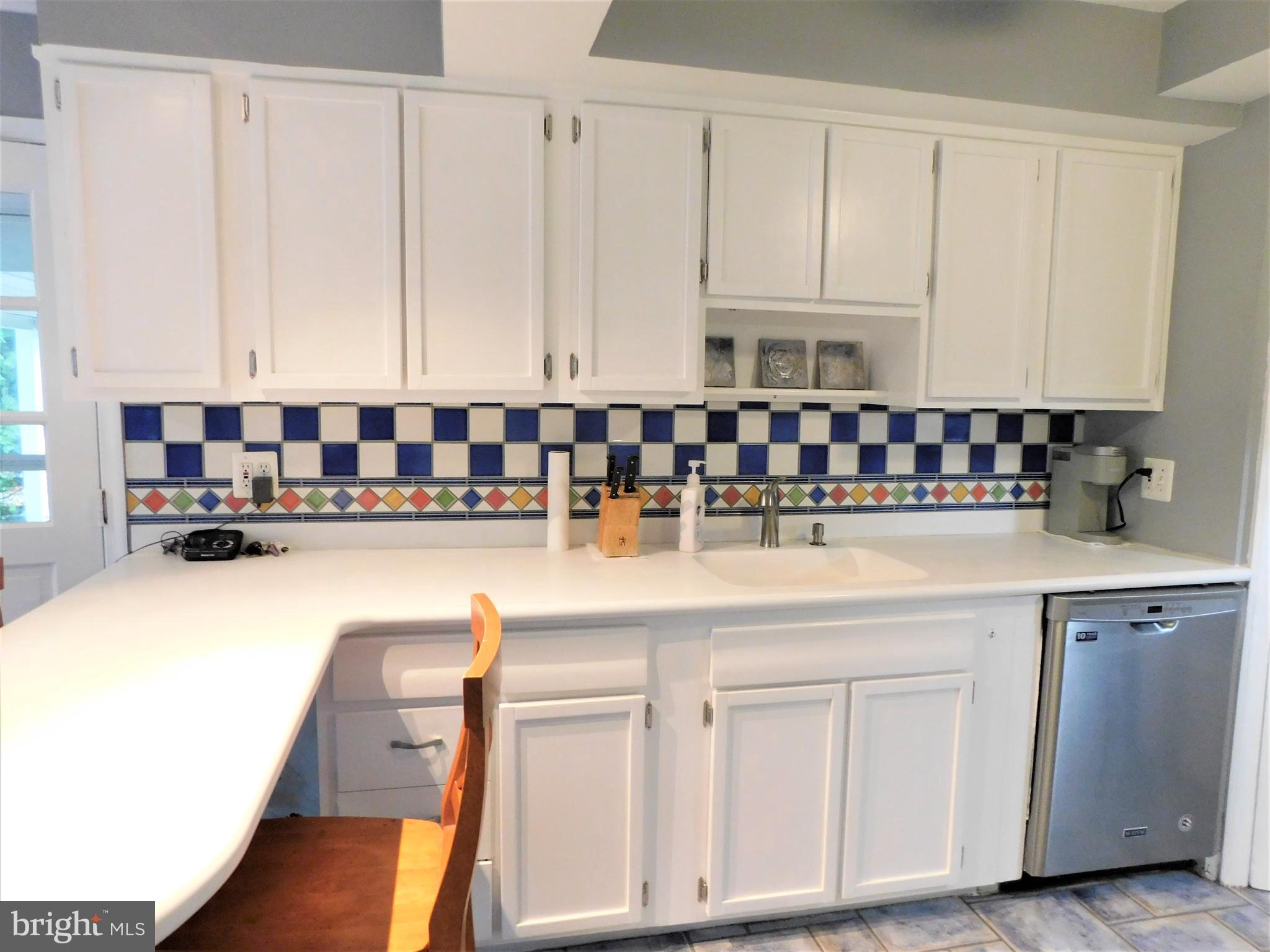 5 West Chelfield Road Glenside, PA 19038 - Photo 32 of 73 White cabinets & counter space tile backsplash