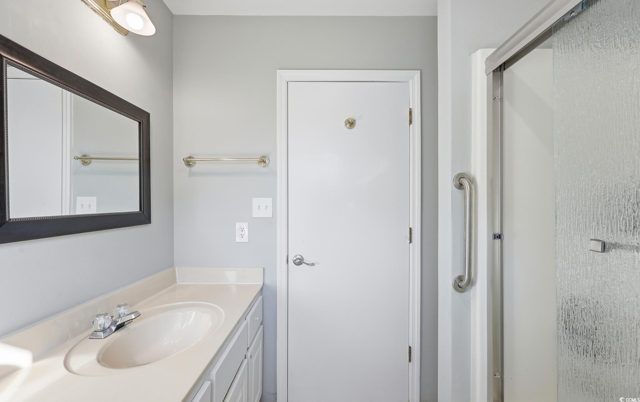 78 Wicklow Way Pawleys Island, SC 29585 - Photo 16 of 37 Full bath featuring vanity and an enclosed shower
