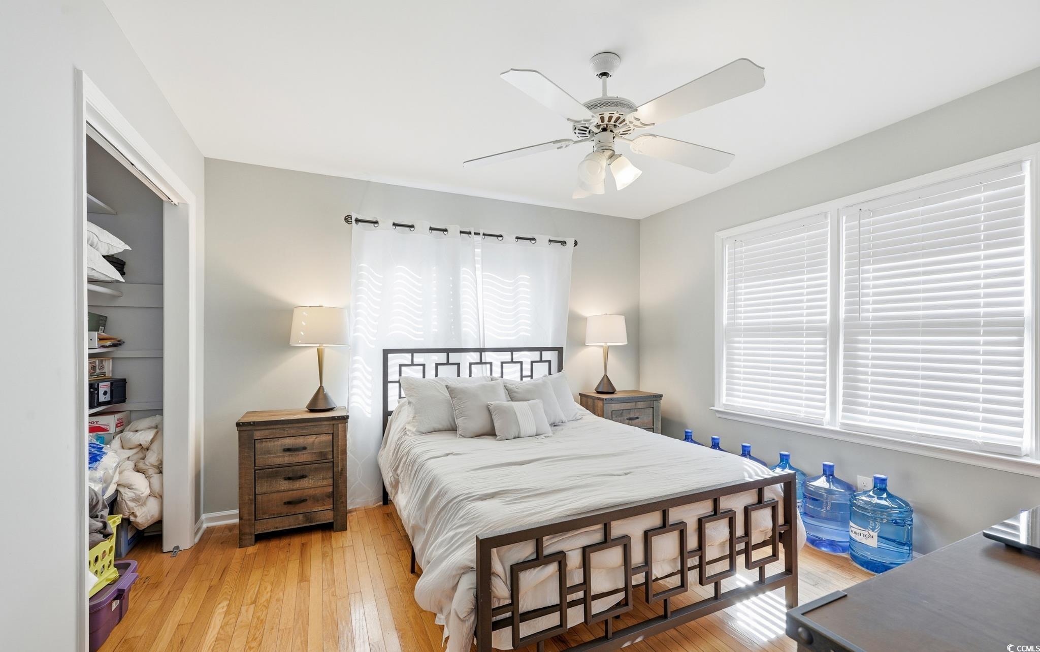 78 Wicklow Way Pawleys Island, SC 29585 - Photo 25 of 37 Bedroom featuring a closet, light wood-style flooring, and ceiling fan